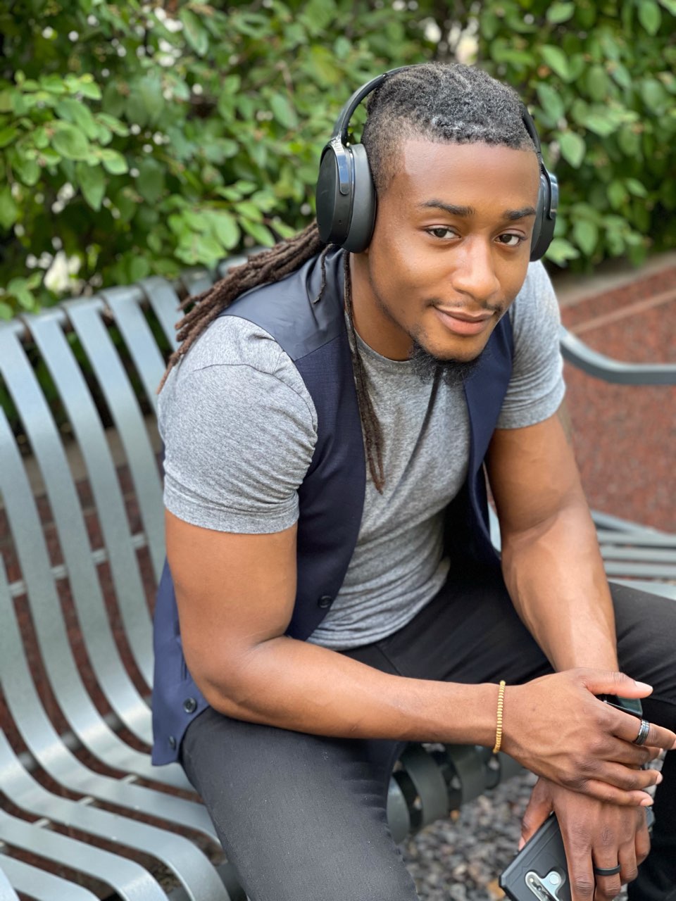 Uriane Robinson enjoying warm weather in Chicago and taking photos for his business Dev Uriane by the riverside.